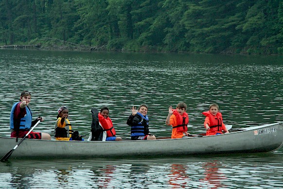 Six powerful paddlers cruising Leesville Lake.